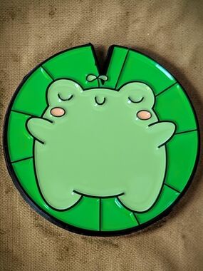 Cute Green Frog Chilling on A Lily Pad